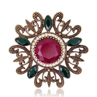 China Vintage Fashion Women Brooch Hollow Alloy Ruby Rhinestone Brooch for sale