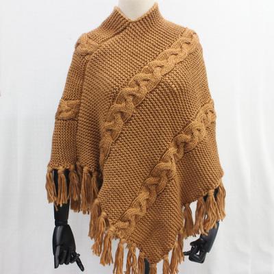 China Fashion Acrylic Yarn Cable Jaquard Nomad Tassel Knit Poncho Knit Shawls For Women for sale