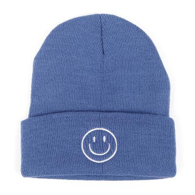 China COMMON New Winter Smiling Face Embroidery Knitted Hat Solid Color Breathable Knitted Hat for sale