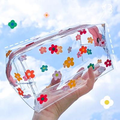 China 2021 Wholesale High Quality Large Capacity Cute Transparent Cosmetic Wash Bag Portable PVC Storage Bag for sale