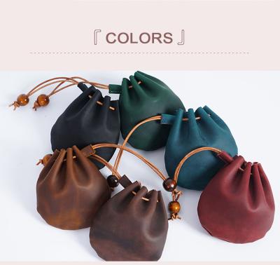 China 2021 Anti-theft Fashion New Drawstring Money Bag PU Leather Coin Storage Bag Retro Mini Wallet for sale