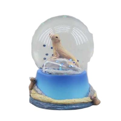 China Custom Europe Souvenir Ocean Park Sealife Snowball Water Globe Mini Snow Globe Cheap Resin For Sale for sale