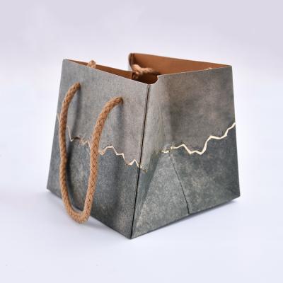 China Square Solid Color Folding Package Recyclable Logo Printing Kraft Paper Bags With Flat Handle for sale