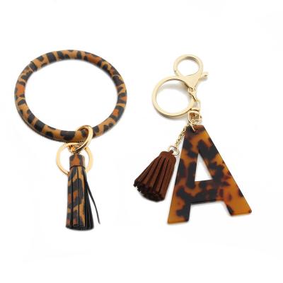 China Leopard Leather PU Leather Keychain For Wristband 2020 New Leo Acrylic Letters Keychain Women Girls PU Wristband for sale