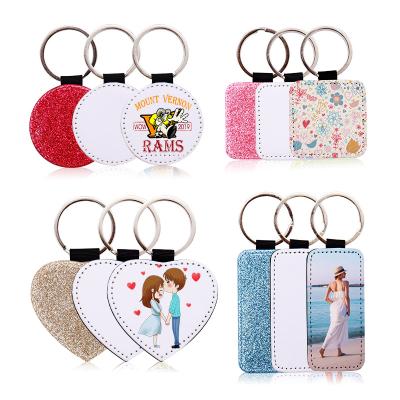 China Wholesale Environmentally Friendly Diy Christmas Heat Transfer Key Chain Ornaments Durable Blank PU Glitter Sublimation Leather Key Chain for sale