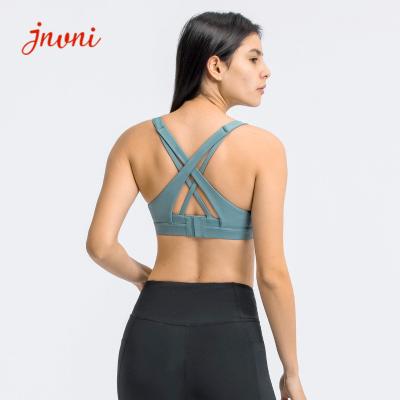 China Strappy Sport-BH für Frauen das sexy kreuzweise hintere Adjustble-Knopf-Yoga, das athletische Turnhallen-Trainings-Eignungs-Spitzen laufen lässt zu verkaufen