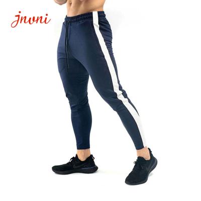 China Ritssluitingsmensen die de Fitness van Broeksporten Legginggymnastiek Jogger Bodybuilding Sweatpants in werking stellen Te koop