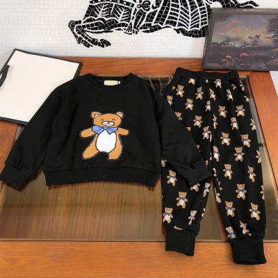 China Economical Anti-wrinkle Custom Design 2 Piece Kids Tracksuit Boys Black And White Bear Print Boys Casual Suits for sale