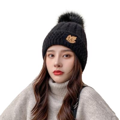 China Unisex Custom Beanie Hat Custom Logo High Quality Plain Acrylic COMMON Winter Knitted Hats With Pom Poms for sale