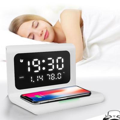 China Hot Selling Amazon Tablet Digital Thermometer Folding Creative Portable Fast Charger Radio Alarm Clock Charging Calendar For Bedside for sale