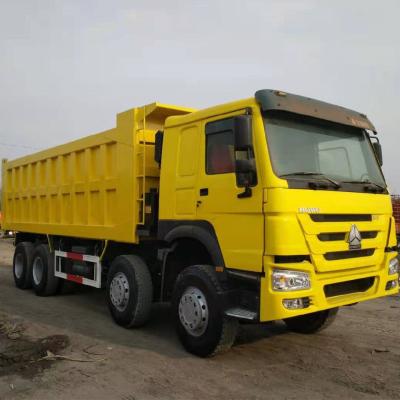 China Sinotruk HOWO 8X4 371HP Secondhand Yellow Dump Truck with Manual Transmission Type for sale