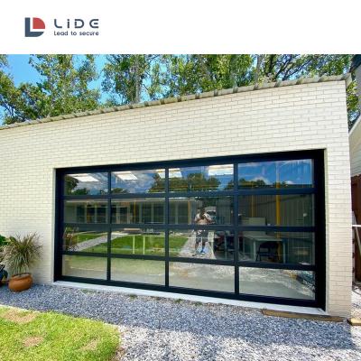 China Heat Insulation Door Fully Transparent Tempered Glass Sectional Garage Doors for sale