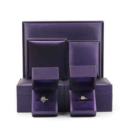 China 2020 Luxury Purple Leather Eco-friendly Jewelry Boxes PU Leather Jewelry Box Ring Earring Jewelry Packaging Box for sale