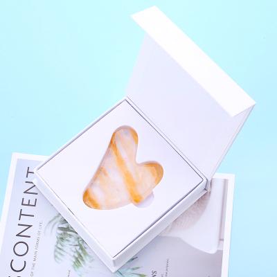 China Hot-selling Gua Sha Scraper Flower Jade Gua Sha Yellow Glue Body Health Massage New Heart Shaped Stone for sale