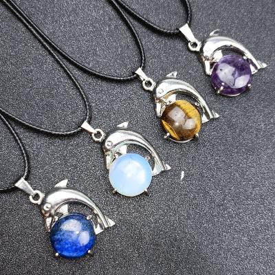 China Other Spot Natural Crystal Energy Necklace Dolphin Play Ball Ring Face Inlaid Reiki Necklace for sale