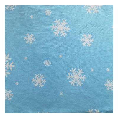 China Memory popular snowflake printed polyester elastic knitted milk silk fabric is used for pajamas children's suit fabric for sale