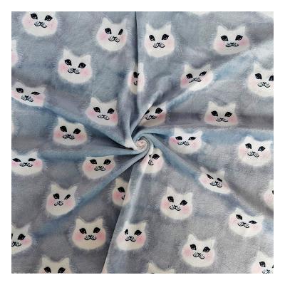 China Tear-resistant newly designed cat's head printed polyester velvet fabric is used for fall and winter home clothes and toy flannel fabric for sale