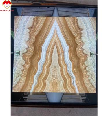 China Modern Design Style Backlit Yellow Onyx Book Matching with Modern Natural Tiger Onyx Slab for sale