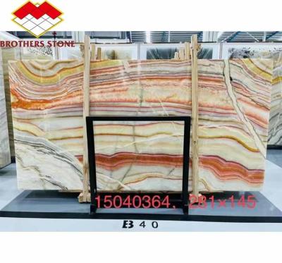 China Hotel Table Furniture Design with Natural Stone Bookmatched Rainbow Onyx Marble Slab for sale