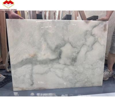 China Pedra de mármore de ónix dourado e azul para o chão do hotel luxo pedra natural jade Slab Design à venda