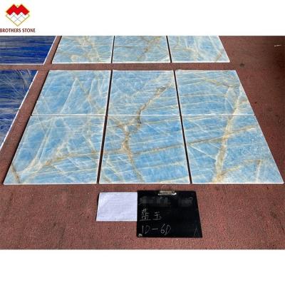 China Light Blue Marble Jade Onyx Slab for Customized Cut-to-size Tiles Golden Veins for sale