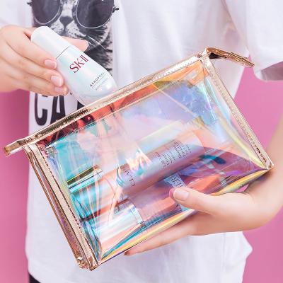 China Holographic Waterproof Running Clear Waterproof Clear Toiletry Bag Makeup PVC Travel Cosmetic Bag With Custom Logo In Stock. for sale