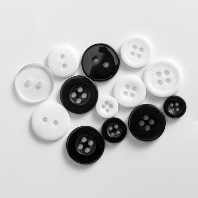 China Dry Cleaning Resin Button Round Sew Roll Shape 2 Holes Clear Shirt Transparent Resin Button for sale