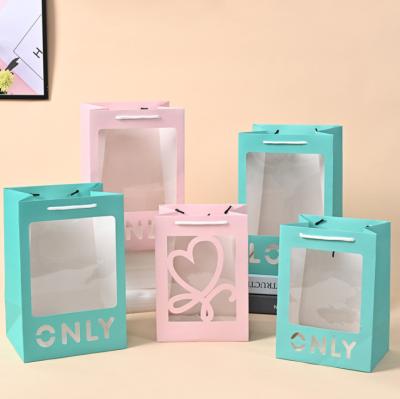 China Blue PVC Window Cardboard Gift Bags With Laser Cut Love Recyclable Tote With Handle for sale