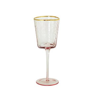 China Unique Product Wholesale 330ml Hand Blown Trigle Shape Party Rose Wine Glasses Hammer Eye Grain Wine Glass With Gold Rim for sale