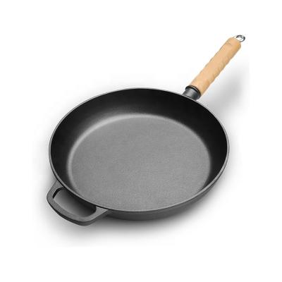 China Sustainable Healthy Universal Camping Barbecue Cooking Tool Round Large Frying Pan Cast Iron Skillet Pan With Wooden Handle for sale