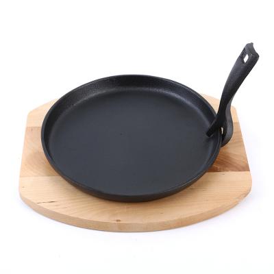 China Sustainable Cookware Cast Iron Sizzling Pan Sizzling Hot Plate With Wooden Base for sale