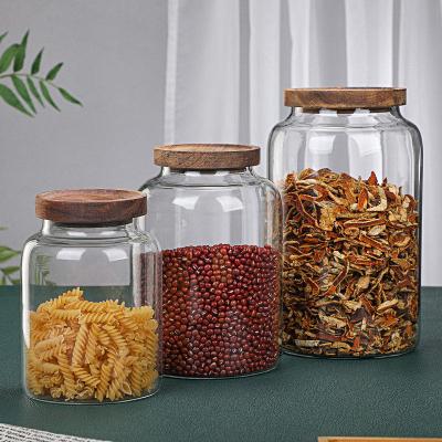 China Clear Freshness Keeping Kitchen Glass Jars For Home Kitchen Thicken Airtight Food Storage Jar With Wooden Lid for sale