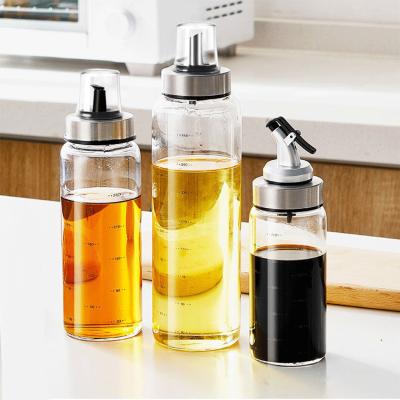 China Freshness Preservation 500ml Edible Oil Bottle Kitchen Sauce Shiny Clear Glass Condiment Set With Metal Spout Spout for sale