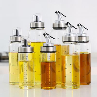 China Freshness retention blown around high borosilicate glass oil to dispense bottle with spout for sale