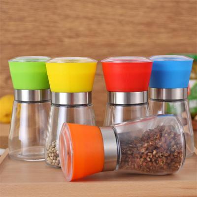 China Sustainable Spice Tool Glass Bottle Pink Salt Cutters Kitchen Manual Salt and Pepper Grinders Set with Stainless Steel Grinder Cap for sale