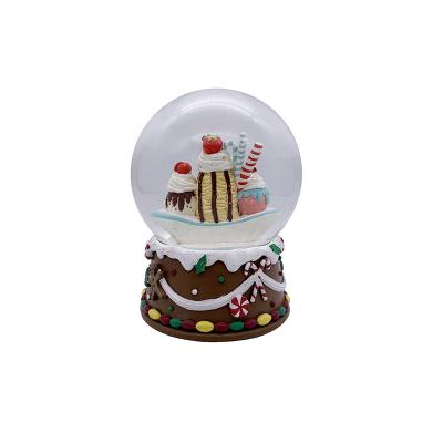 China Global Hot Sale Resin Hand Painted Gingerbread Banana Boat Snow Globe For Children for sale