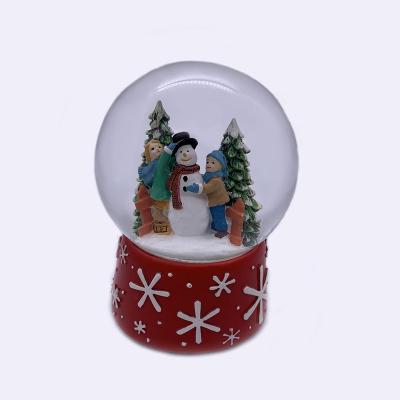 China Snow World Crystal Ball For Chrismtas of Resin Winter Scene Snowman and Christmas Trees 100mm for sale