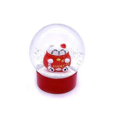 China Worldwide 100MM Resin Lucky Cat Snow Globe For Home Decoration for sale