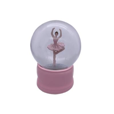 China Musical Beautiful Pink Design Resin Globe 120MM Snow Globe 120MM Rotating Balleria Snow Globe for sale