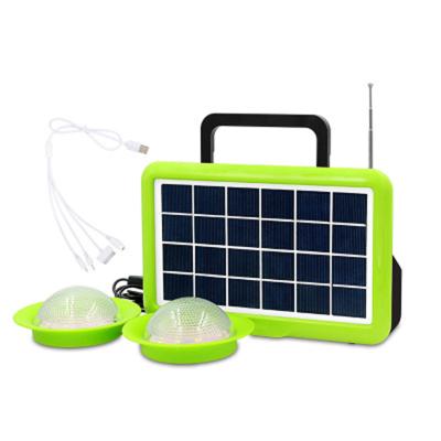 China Solar System Home Light Rechargeable Lithium Battery With Speaker Radio Function With Flying Saucer Light Shell Charger for sale