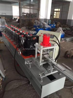 China 0.6-1.5mm PLC Control 12 Stations Transmission Metal Shutter Chain Door Slats Roll Forming Machine for sale