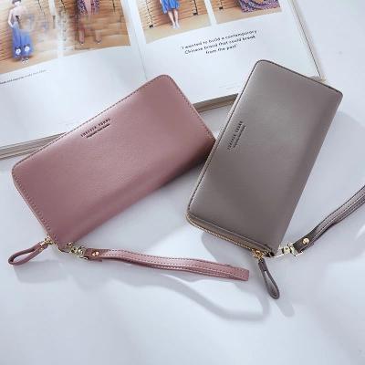 China Custom Logo Long Wristloop Ladies Women Waterproof Minimalist Wallet Passport Card Holder Travel Leather Wallets For Women for sale