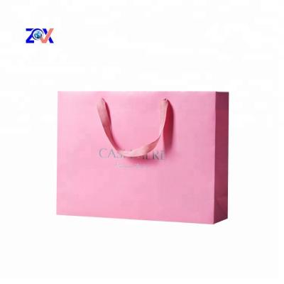 China Custom Wholesale Cheap Disposable Printed Pink Luxury Retail Shopping Kraft Paper Gift Bag With Logos Design for sale