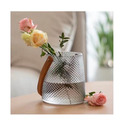 China Transparent glass jar of the latest desktop home design minimalist creative hand-held vase ornaments for sale