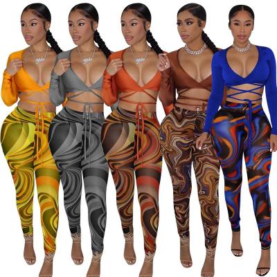 China 2023 Polyester Women Clothing Bandage Sexy Hollow V-Neck Two Piece Set Crop And Pants Set Bodycon Sexy Suit for sale