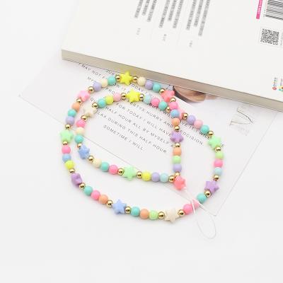 China Durable Phone Chain Coloful Gold Beaded Crystal Flower Wrist Strap Phone Case Cute Smile Start for sale