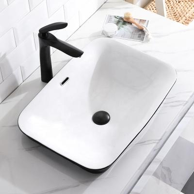 China 2020 Manufacturer Best Selling Modern Rectangular Ceramic Sink Art Hand Wash Basin With Black Sanitary Edge for sale