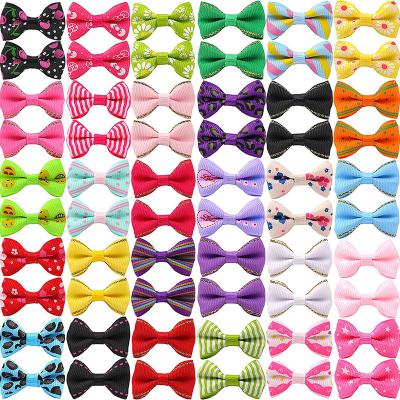 China Puppy Pet Small Bowknot Stocked Hair Bows With Metal Clips Elastic Bands Handmade Dog Hair Accessories Bows Pet Grooming Products for sale