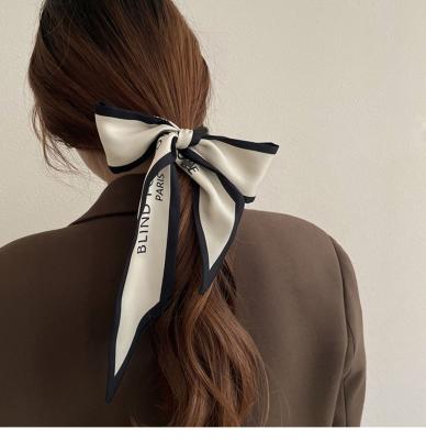 China Sumper popular spring letter narrow ribbon tied bag handle scarf women multifunctional simple vintage soft silk hair scarf for sale