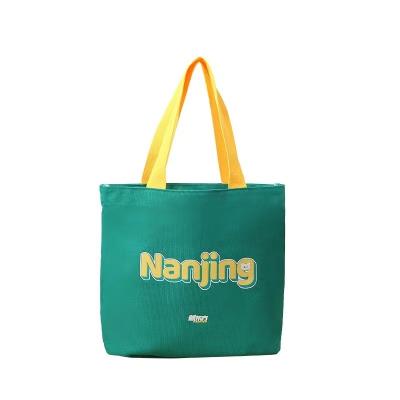 China Small Portable Promotional Green Printed Fabric Cotton Canvas Bag Bulk Waxed Handbags Women For Crafts for sale